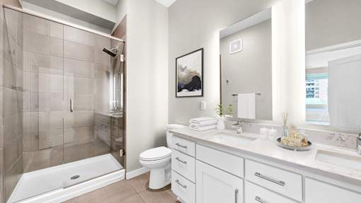 A bathroom with a white toilet and a white sink.