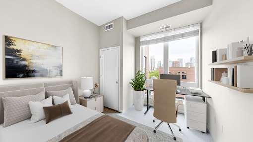 A modern bedroom with a large bed and a desk with a chair.