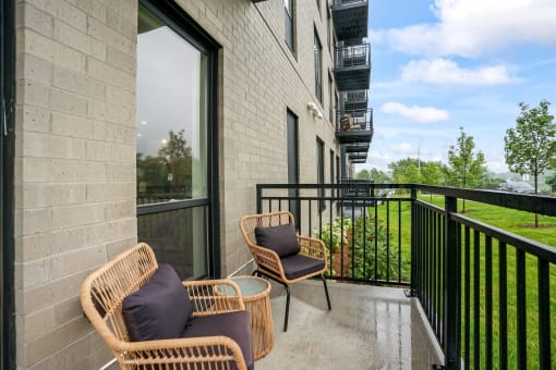 the reserve at city center spacious balcony with wicker chairs