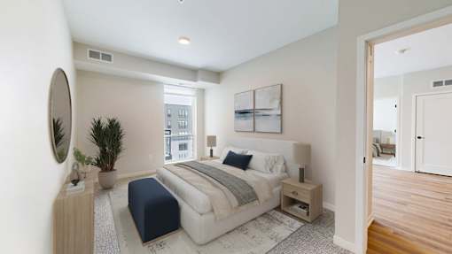 A bedroom with a large bed and a mirror on the wall.