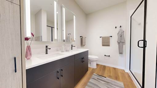 A bathroom with a white sink and a mirror above it.