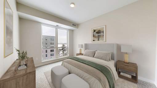 A bedroom with a large bed and a window overlooking a cityscape.