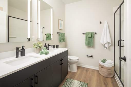 A bathroom with a white sink and a toilet.