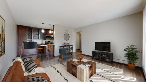 a living room with a couch a coffee table and a tv