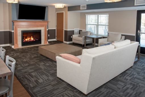 Community room with fireplace, tv and lounge area