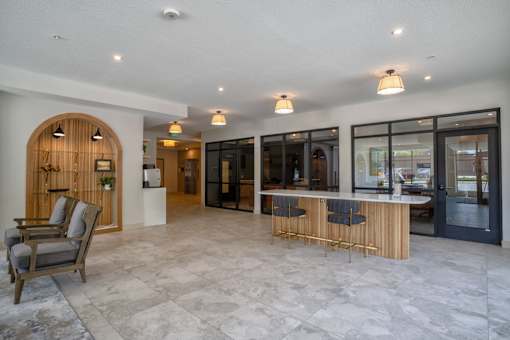 A spacious interior with a bar area and seating.