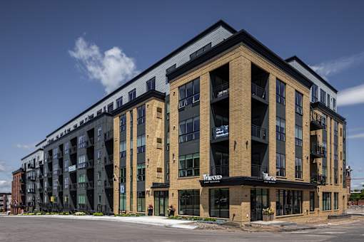 A large multi-story building with the word "Warnock" on the front.