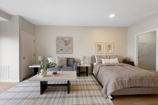 a bedroom with a bed and a couch