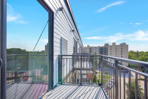 a balcony with a view of the city