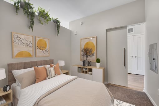 a bedroom with a large bed and a door to a bathroom