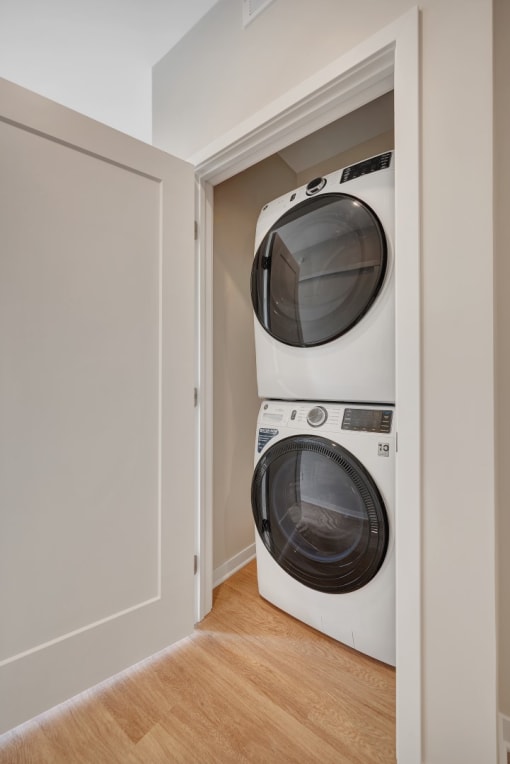 a washer and dryer in a small laundry room