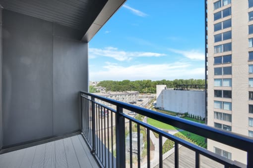 a balcony with a view of a city