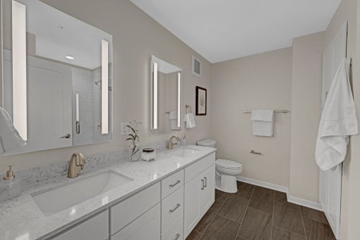 a white bathroom with a sink and a toilet