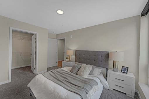 a bedroom with a bed and a closet