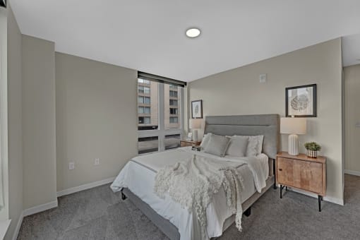 a bedroom with a large bed and a window