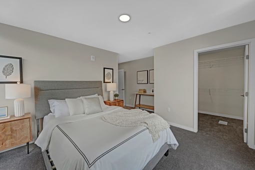 a bedroom with a large bed and a closet