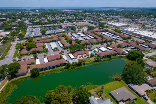 an aerial view of a city with a body of water