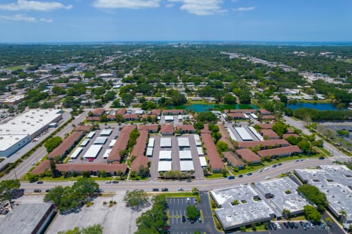 an aerial view of a city with many buildings and trees