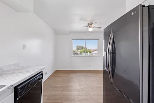 Kitchen with refrigerator at Ocean Villas Apartments, Oxnard, 93033