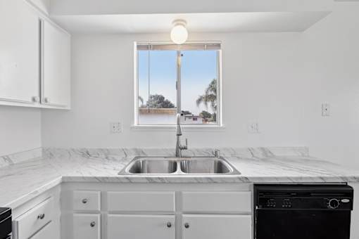 Kitchen with window at Ocean Villas Apartments, Oxnard