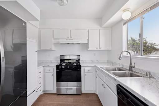 Kitchen with stainless steel appliances at Ocean Villas Apartments, Oxnard, CA, 93033