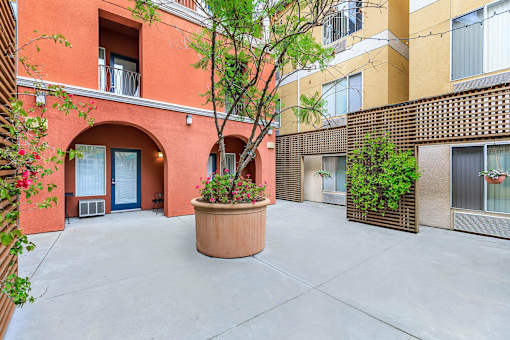 A Courtyard With a Planter In The Middle at Atrium Garden Apartment Homes, LLC, California, 95112