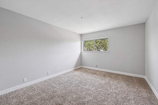 Spacious room with window at Ocean Villas Apartments, California