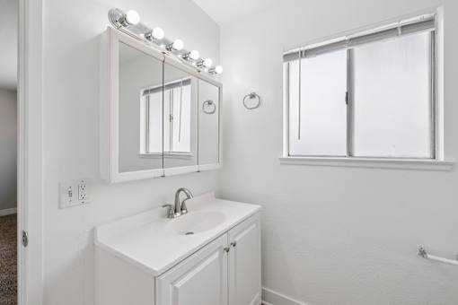Bathroom with sink and mirror at Ocean Villas Apartments, California, 93033