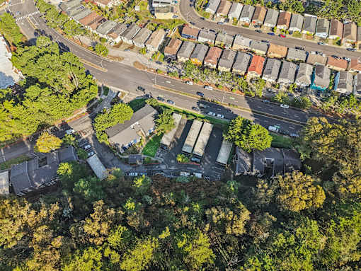 A bird's eye view of a residential area with houses and trees. at Skyline Heights Apartments, Daly City, California
