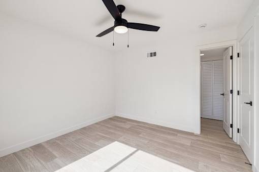 Room with ceiling fan at Ocean Villas Apartments, Oxnard, CA 