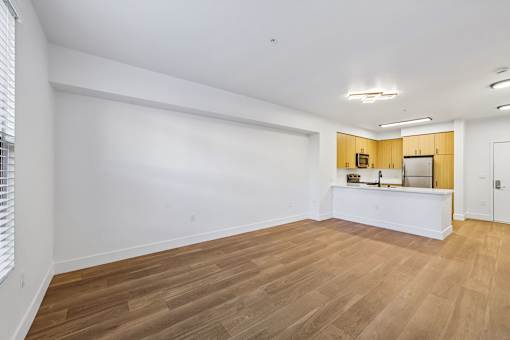 A room with wooden floors and a white counter.