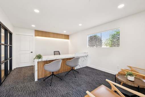 Leasing office with desk and chairs at Ocean Villas Apartments, California, 93033