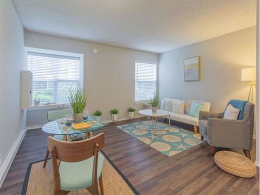a living room with a couch and a table at Skyline Heights Apartments, California, 94015