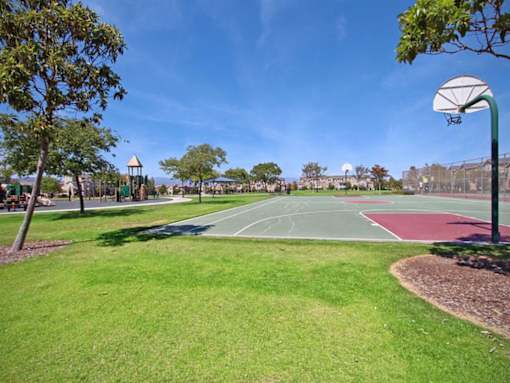 a basketball court in the middle of a park at The Vines at Riverpark, LLC, Oxnard California