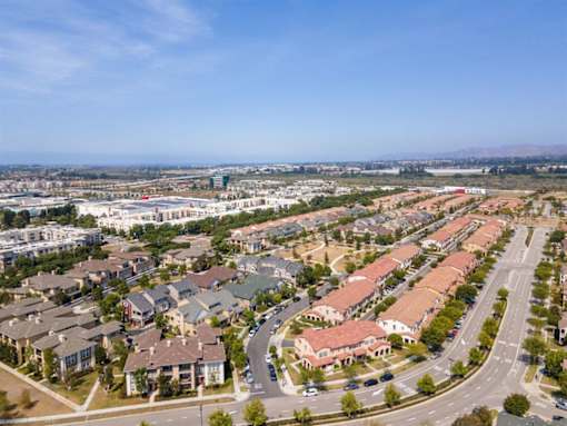 an aerial view of a suburb of a city with cars on the street at The Vines at Riverpark, LLC, California, 93036