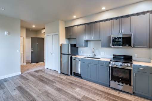 Modern kitchen with stainless steel appliances at 888 Fourth Street Apartments, LLC, Santa Rosa, CA, 95404