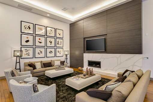 A modern living room with a fireplace and a TV. at Cirrus Redwood City Apartments, Redwood City, CA, 94061