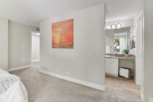 an empty bedroom with a painting on the wall at Summerwood Apartments, Santa Clara, CA 95050