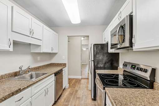 Kitchen with appliances at Summerwood Apartments, Santa Clara, California