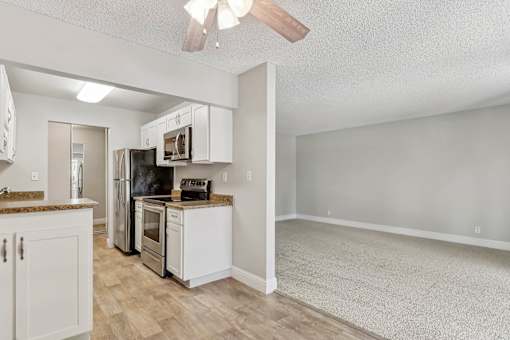an open kitchen and living room with an open floor plan at Summerwood Apartments, Santa Clara, 95050