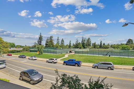a busy highway with cars driving down it at Summerwood Apartments, Santa Clara, CA