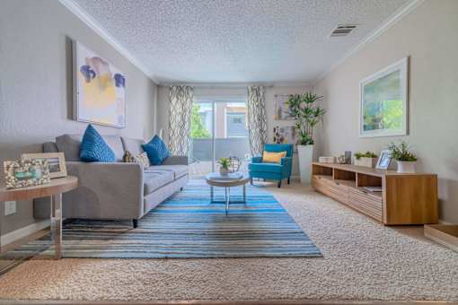 a living room with a couch and a table at City View Apartments at Warner Center, Woodland Hills, CA 91367