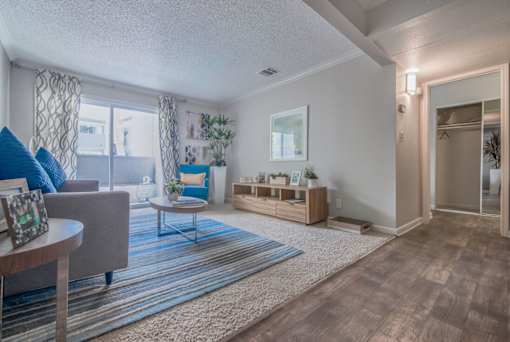 a living room with a geometric design on the wall at City View Apartments at Warner Center, Woodland Hills, 91367