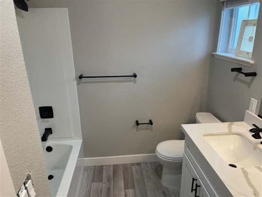 a bathroom with a toilet and a sink at Danville Park, Danville, CA