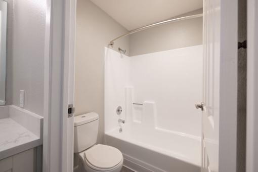 a bathroom with a tub and a toilet and a sink at Diablo Vista, Livermore, California