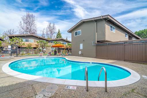 a swimming pool with a house in the background at Element LLC, Sunnyvale, 94086