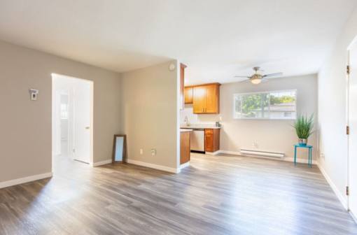 an empty living room and kitchen with a wood floor at Element LLC, Sunnyvale, CA, 94086