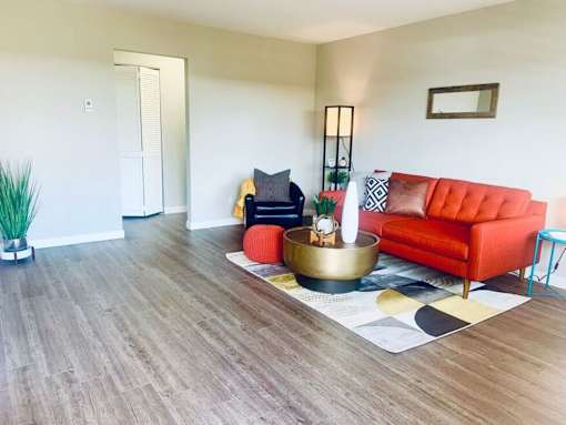 a living room with a couch and a table in it at Element LLC, Sunnyvale