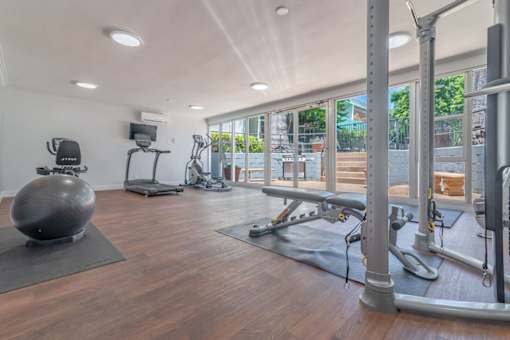 the gym is equipped with a yoga ball and other fitness equipment at The Flats on Addison, Sherman Oaks, CA 91423