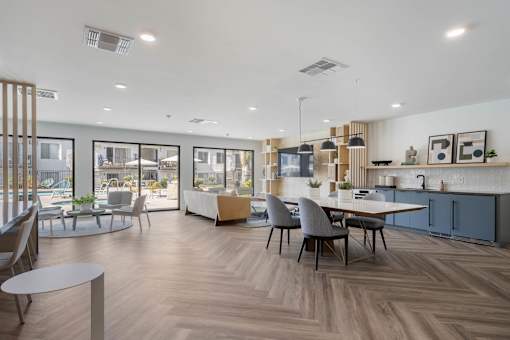 A modern open plan living and dining area with a kitchen at Latitude Apartments at Mission Valley Apartments, California